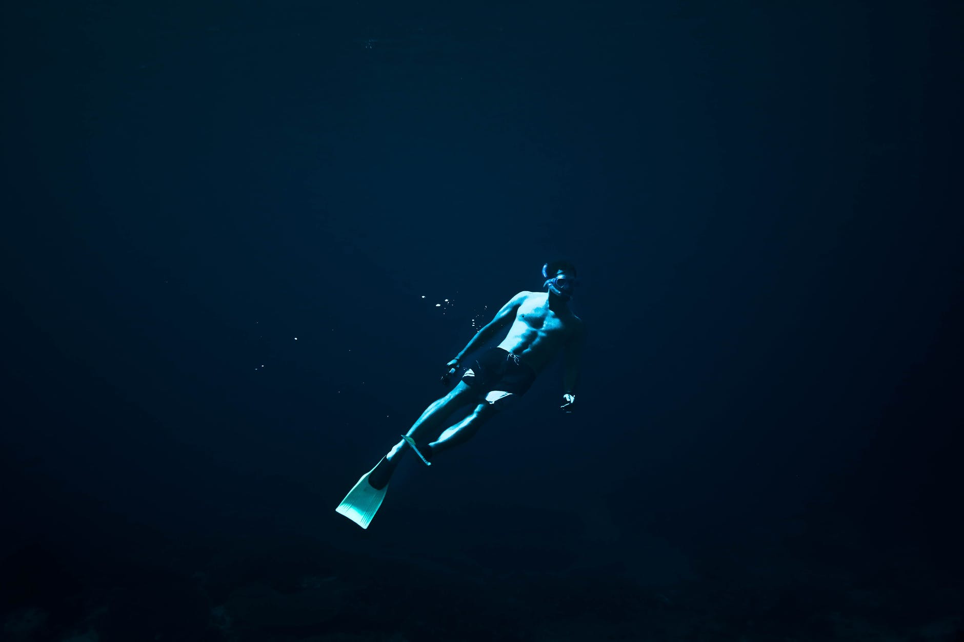 man swimming in the ocean